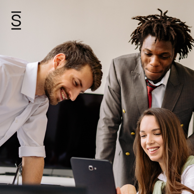 Company culture - three employees looking at a smartphone