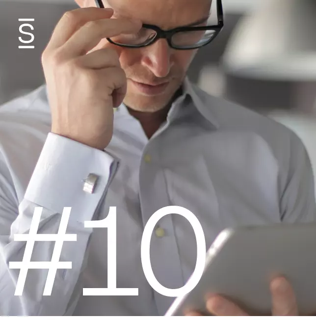 Why intranets fail - man with glasses wearing white shirt looking at tablet computer