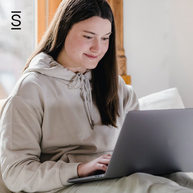 Work From Home - woman in hoodie using laptop computer