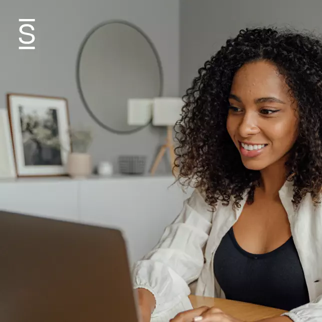 Remote Collaboration - woman using laptop computer in home office