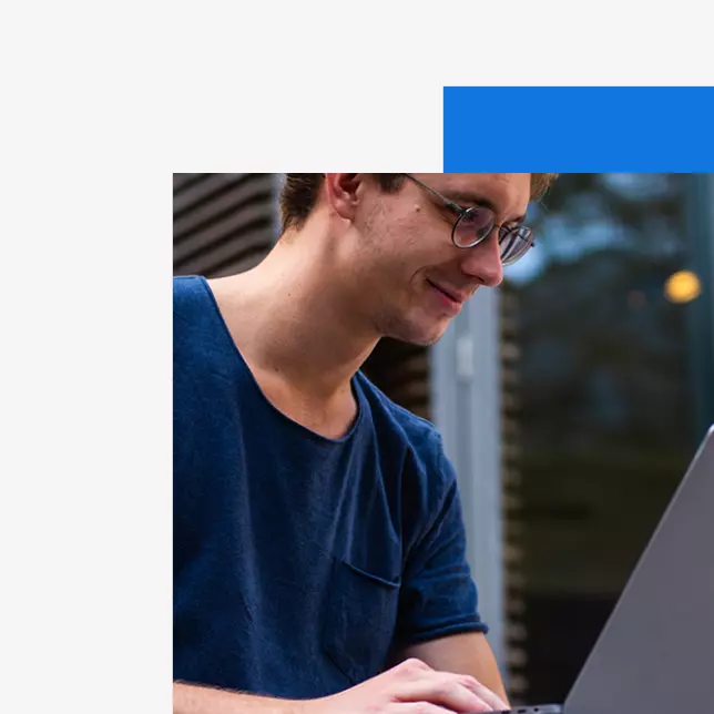 Intranet vs. extranet - man with glasses using computer