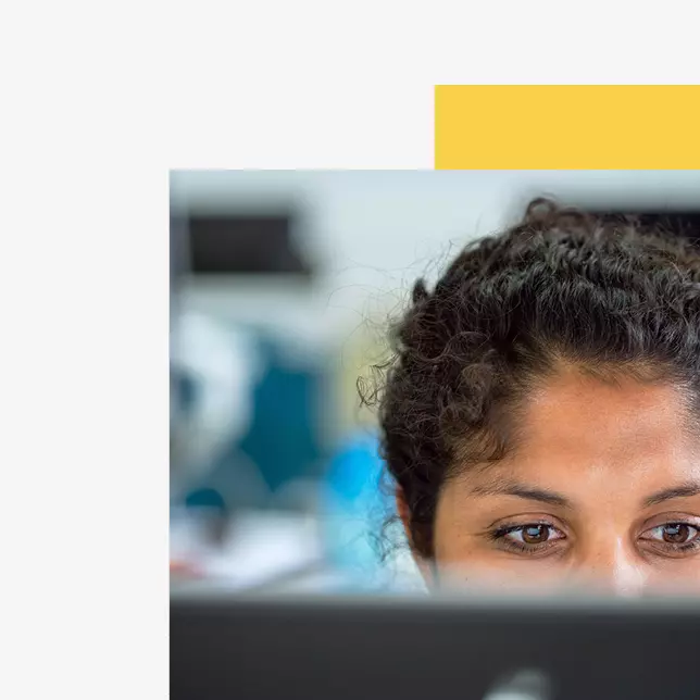 Internal communications and digital transformation - closeup shot of a woman working on a computer